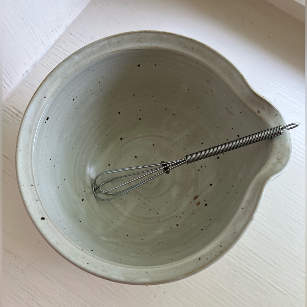 Handmade mixing bowl with small whisk from local artist in Smoky Mountains.